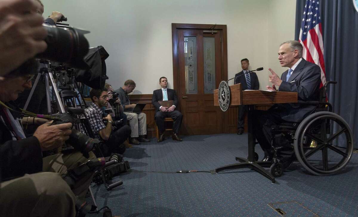 Gov. Greg Abbott used line-item vetoes to cut about $120 million out of the $217 billion budget, which he signed Monday. Abbott is shown at a June 6 news conference.