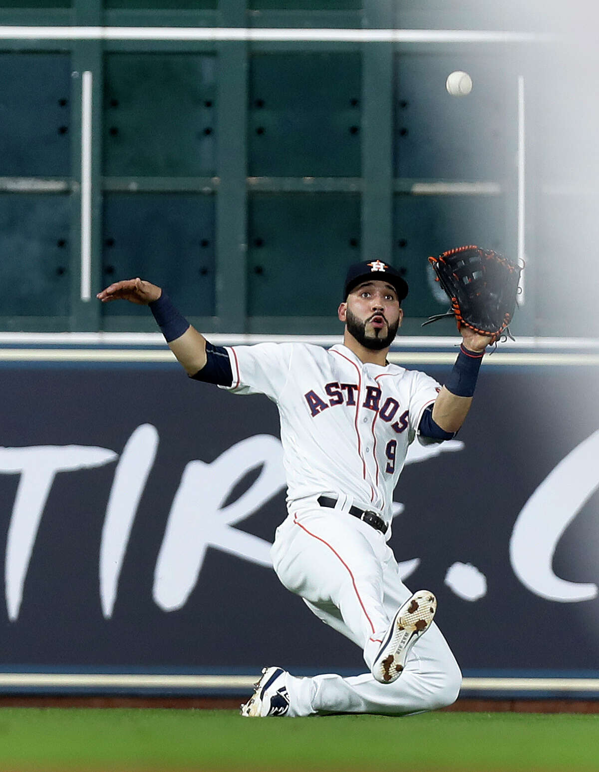 Houston Astros left fielder Marwin Gonzalez (9) catches Texas Rangers designated hitter Shin-Soo Choo line out during the sixth inning of an MLB game at Minute Maid Park, Monday, June, 12, 2017.