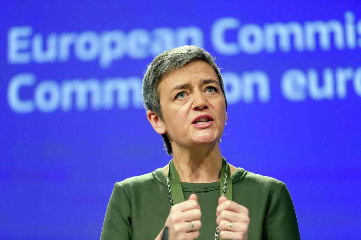 European Commissioner for Competition Margrethe Vestager speaks during a media conference at EU headquarters in Brussels on Wednesday, Dec. 7, 2016. European Union regulators on Wednesday fined banks JPMorgan Chase, HSBC and Credit Agricole a combined $520 million for colluding to manipulate the price of financial products linked to interest rates. (AP Photo/Thierry Monasse)