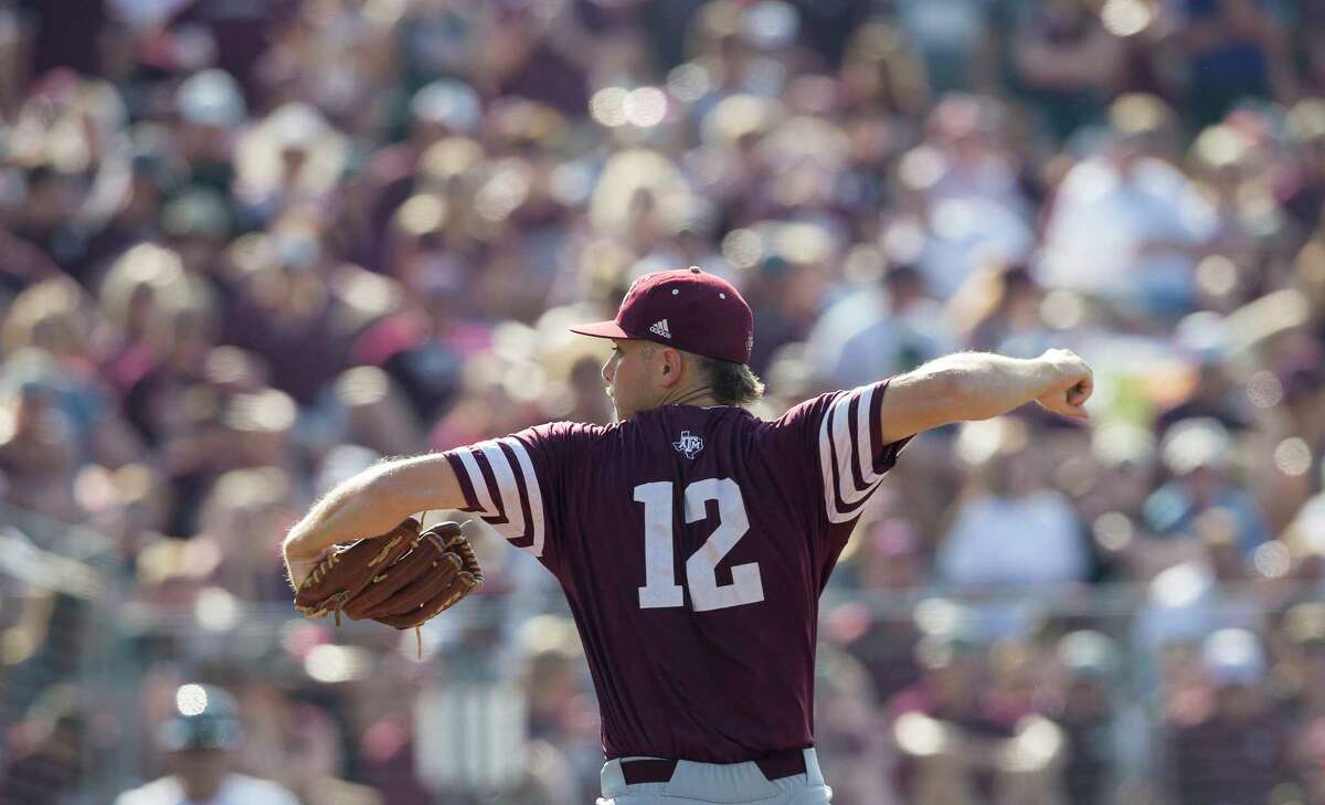 Texas A&M pitcher Corbin Martin (12) throws to home against Davidson during the second inning of an NCAA college baseball tournament super regional game Saturday, June 10, 2017, in College Station, Texas. Texas A&M won 12-6 to advance to the College World Series. (AP Photo/Sam Craft)