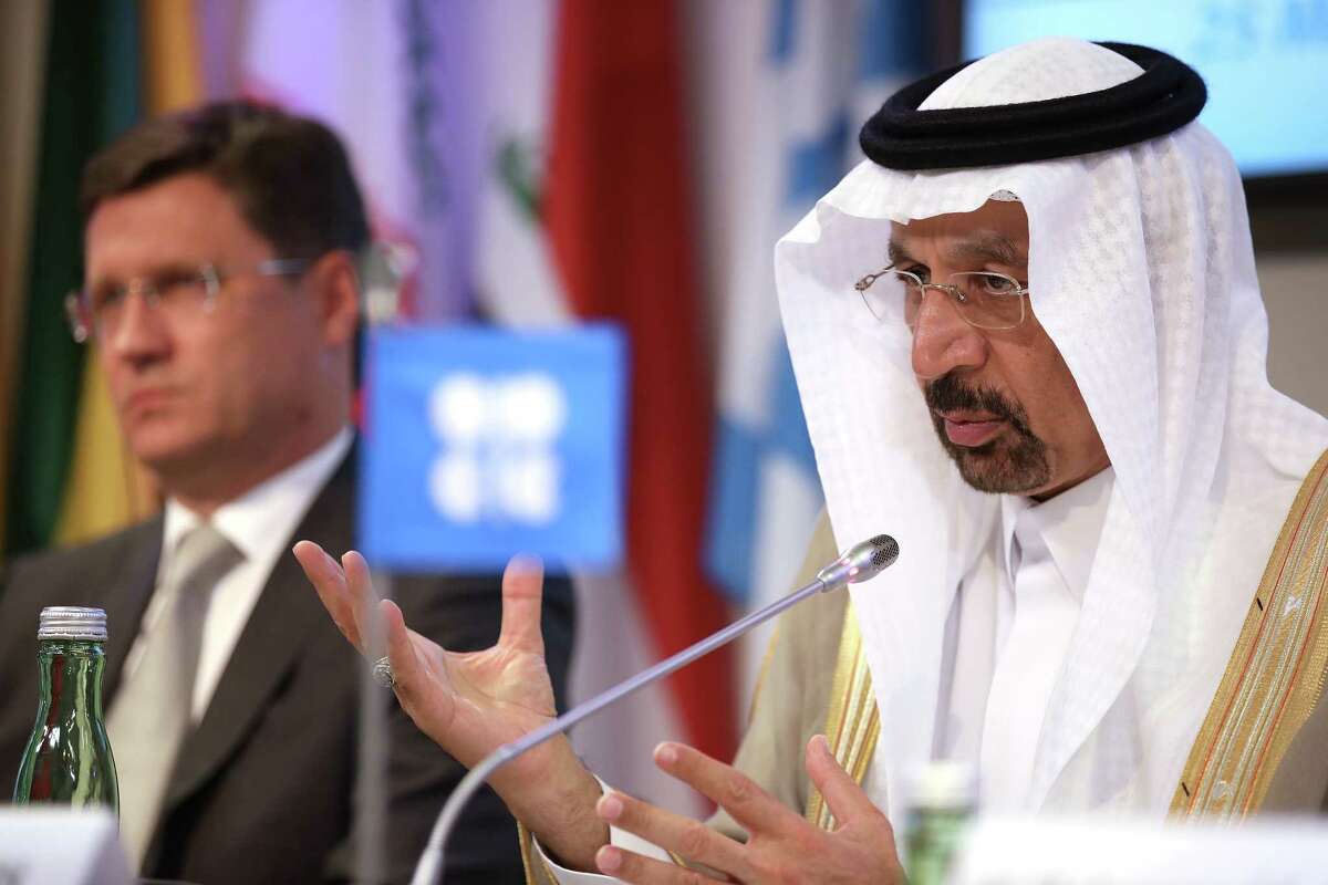 Khalid Bin Abdulaziz Al-Falih, Saudi Arabia's energy minister and president of OPEC, speaks as Alexander Novak, Russia's energy minister, left, listens during a news conference following the 172nd Organization of Petroleum Exporting Countries (OPEC) meeting in Vienna, Austria, on Thursday, May 25, 2017. OPEC extended oil production cuts for nine more months after last year's landmark agreement failed to eliminate the global oversupply or achieve a sustained price recovery. Photographer: Akos Stiller/Bloomberg