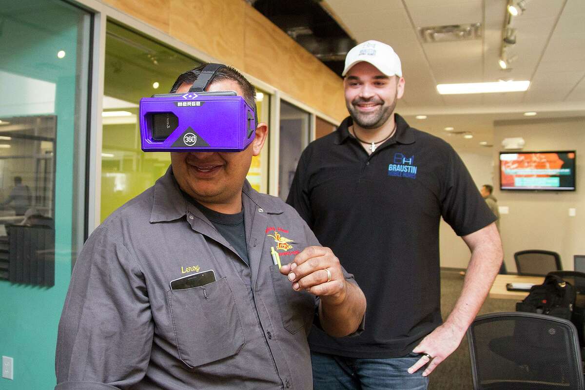 Leroy Chavez, a client of Braustin Mobile Homes, “tours” his future home using a pair of virtual-reality goggles.