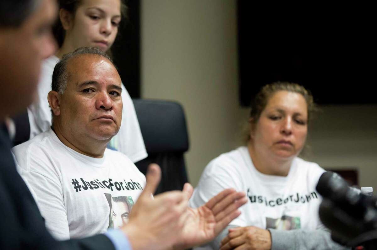 Ignacio Hernandez, center, listens to lawyer Randall Kallinen during a press conference announcing the civil lawsuit against Chauna and Terry Thompson at Chandler McNulty office Tuesday, June 13, 2017, in Houston. The Thompsons have been indicted on murder charges in the death of John Hernandez, Ignacio's son, who was taken off life support May 31 following a confrontation with the couple outside a Denny's restaurant on May 28.