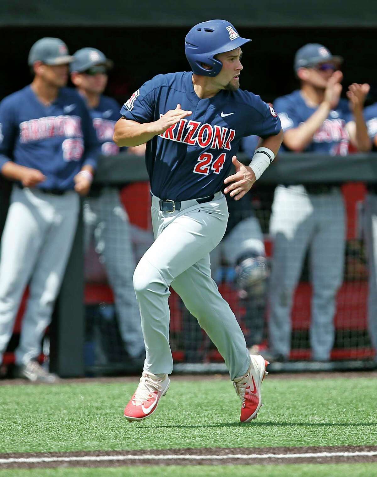 Arizona's JJ Matijevic (24) watches the ball land in center field while running to home plate during an NCAA college baseball regional game against Delaware, Saturday, June 3, 2017, in Lubbock, Texas. (Brad Tollefson/Lubbock Avalanche-Journal via AP)