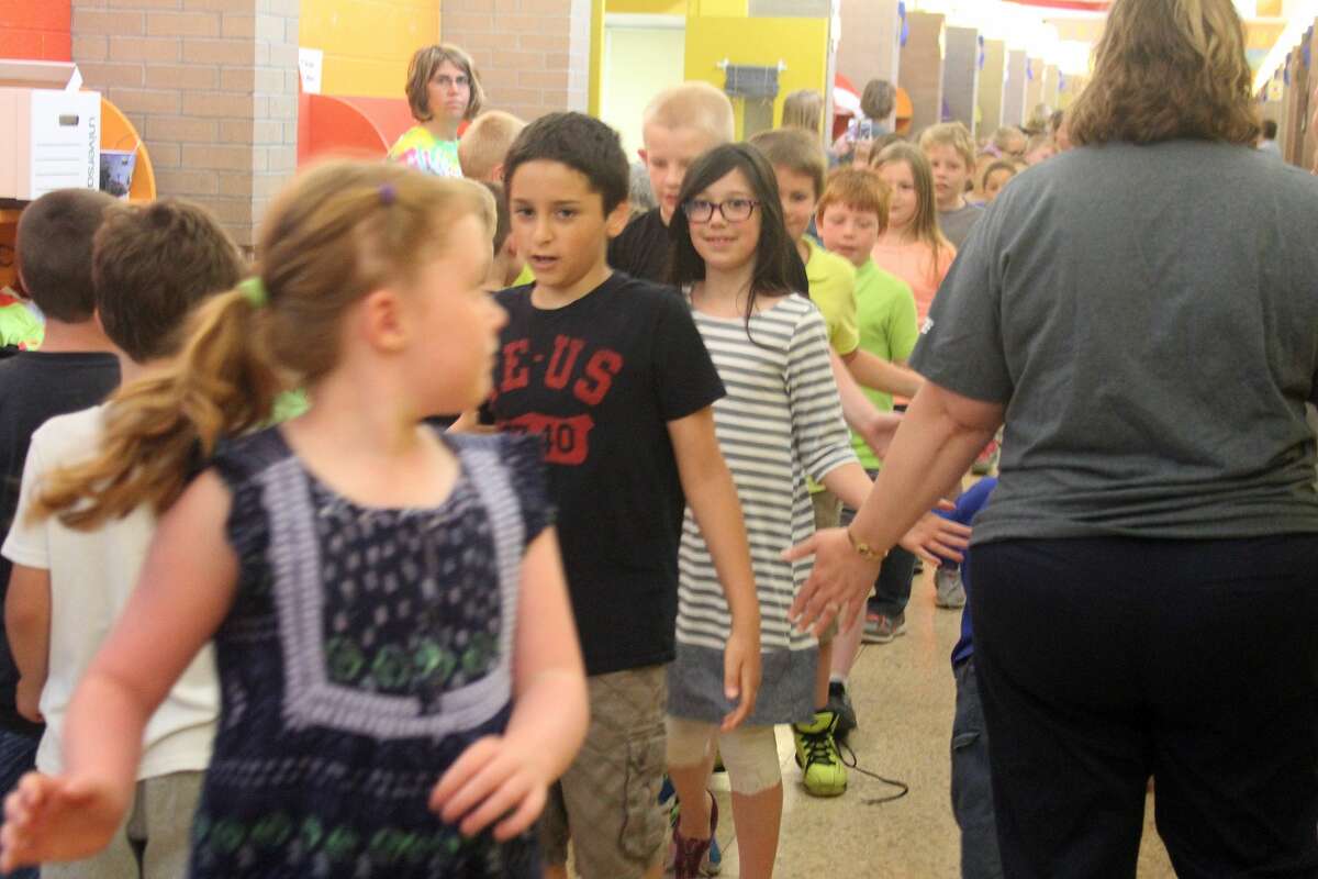 Bad Axe Elementary students and teachers lined the hallways Tuesday for a send-off event wishing third graders the best as they will move on to middle school next fall. The group also honored retiring second grade teacher Amanda Knox.