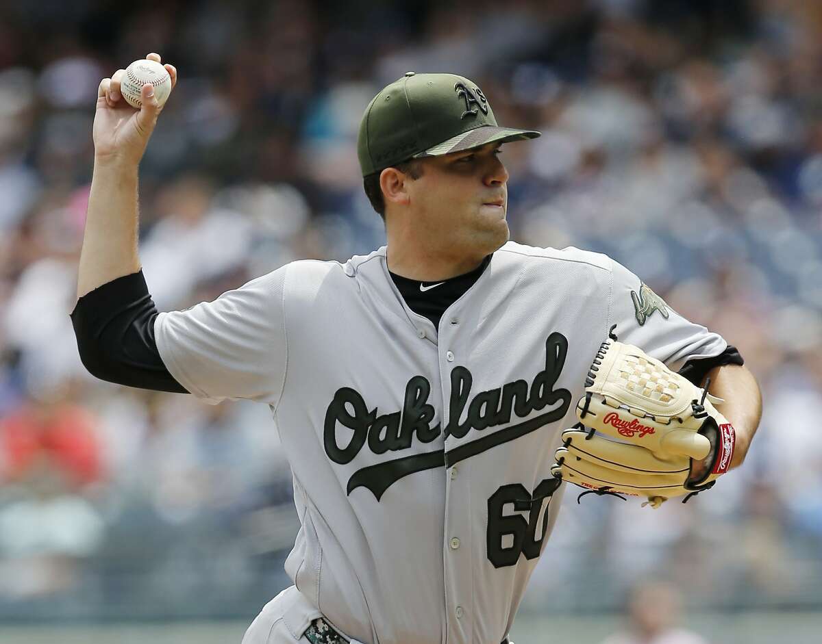 Oakland Athletics starting pitcher Andrew Triggs (60) delivers during the first inning of a baseball game against the New York Yankees in New York, Sunday, May 28, 2017. (AP Photo/Kathy Willens)