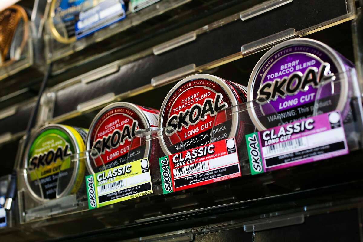 FILE – Flavored tobacco is seen on the shelves at City Smoke and Vape Shop in San Francisco in this file photo from Sunday, June 11, 2017. Oakland, SF's neighbor to the East, is the latest California city to ban flavored tobacco.
