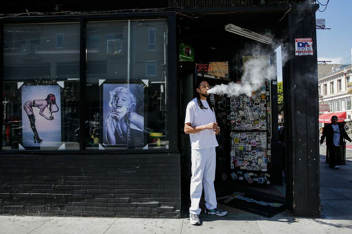 Store employee Khalil G. takes a smoke break outside of City Smoke and Vape Shop in San Francisco, California, on Sunday June 11, 2017.