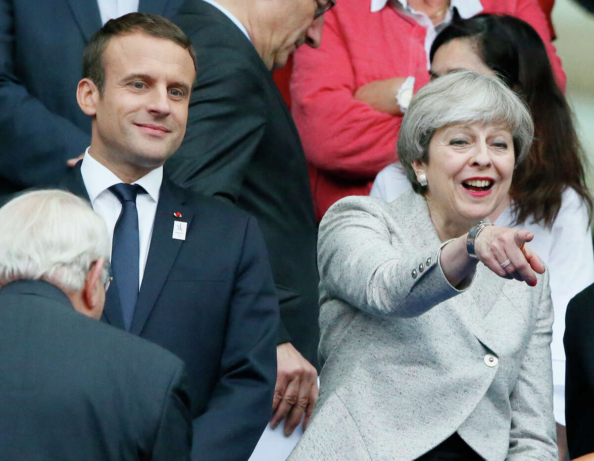 French President Emmanuel Macron and Britain's Prime Minister Theresa May attend a friendly soccer match between France and England at the Stade de France in Saint Denis, north of Paris, France, Tuesday, June 13, 2017. After their talks at the Elysee Palace, the two leaders watch a France-England football match that will honor victims of extremist attacks in both countries. (AP Photo/Francois Mori