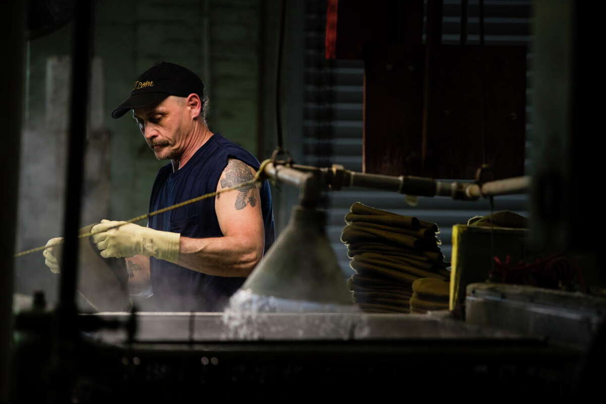 A worker helps make hats at the Bollman Hat Co. in Adamstown, Pa. Factories in the U.S. have expanded for nine straight months.﻿