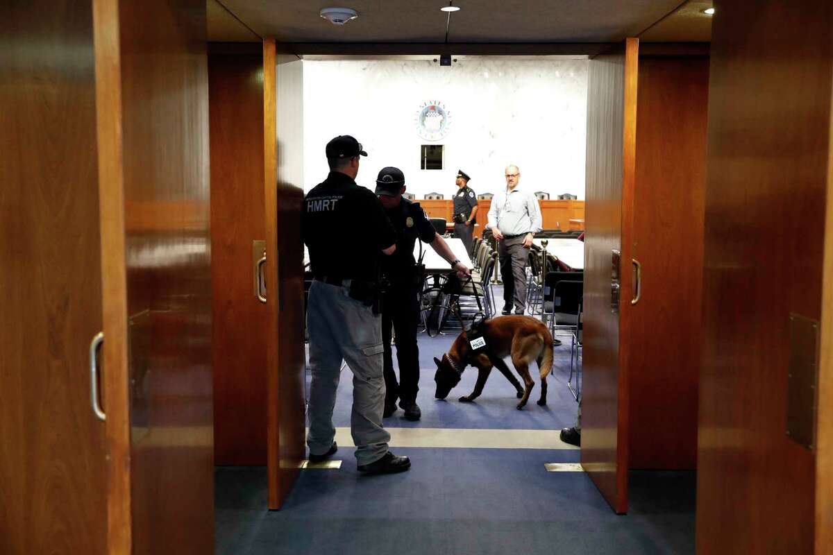 Police sweep a room on Capitol Hill in Washington, Tuesday, June 13, 2017, prior to Attorney General Jeff Sessions testifying before a Senate Intelligence Committee hearing about his role in the firing of James Comey, his Russian contacts during the campaign and his decision to step aside from an investigation into possible ties between Moscow and associates of President Donald Trump. (AP Photo/Alex Brandon)