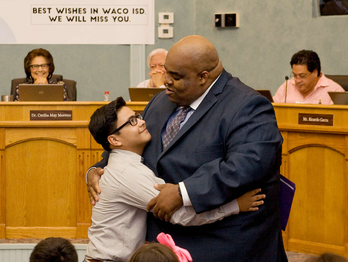 Dr. Marcus Nelson in a thankful embrace with sixth grader Rodrigo Ramos of Lamar Middle School after a farewell speech by the latter during the Laredo I.S.D. Board Meeting on Tuesday, June 13 at the Amber Yeary Board Room.