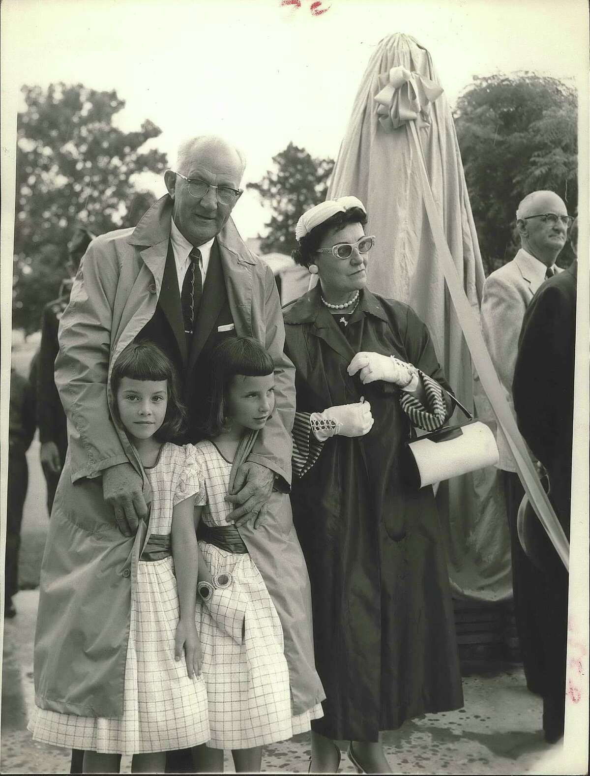 George Strake and his family helping dedicate the "Joe Roughneck" statue on June 5. 1957.