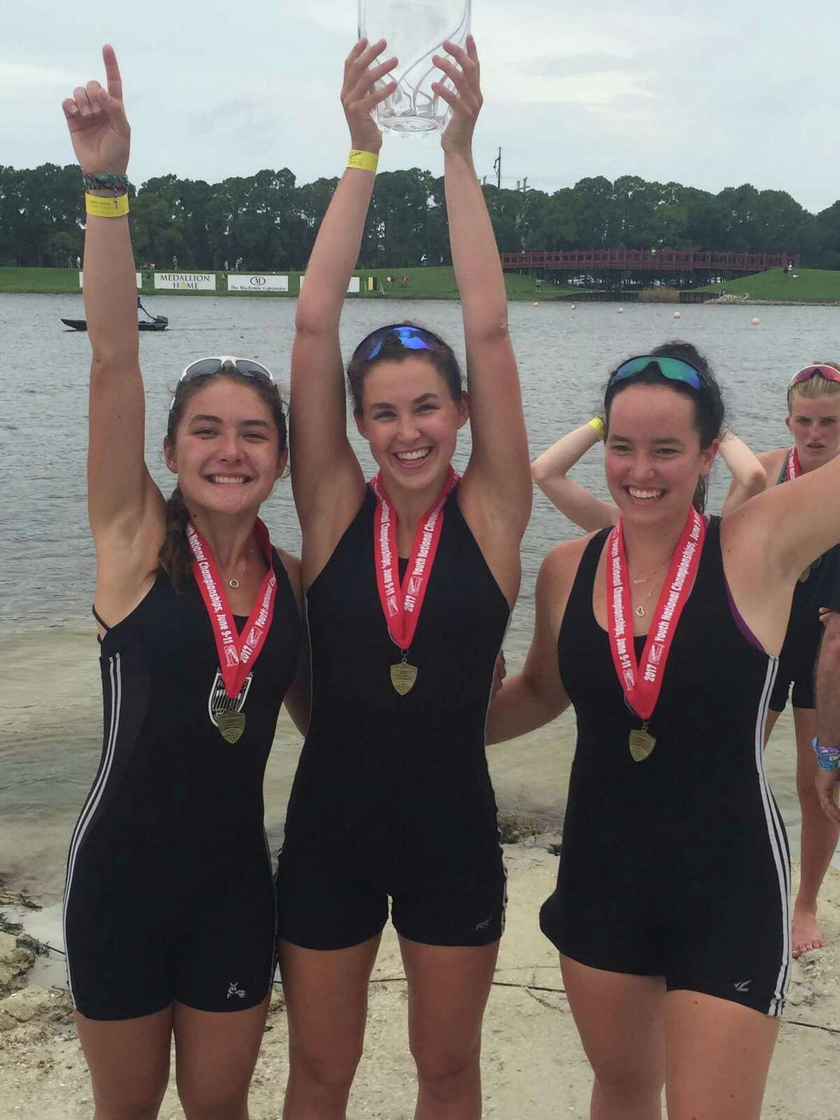 Caitlin Esse of New Canaan (R) celebrates with teammates after winning the womens youth 8+ national championship.