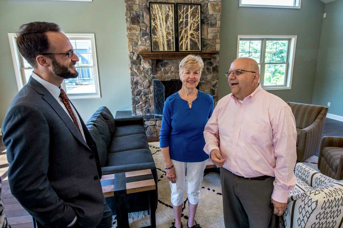 Pat and Charlie Giglio speak with developer James Cerseput in the clubhouse of Mill Hollow Apartments Monday June 12, 2017 in Altamont, N.Y. (Skip Dickstein/Times Union)