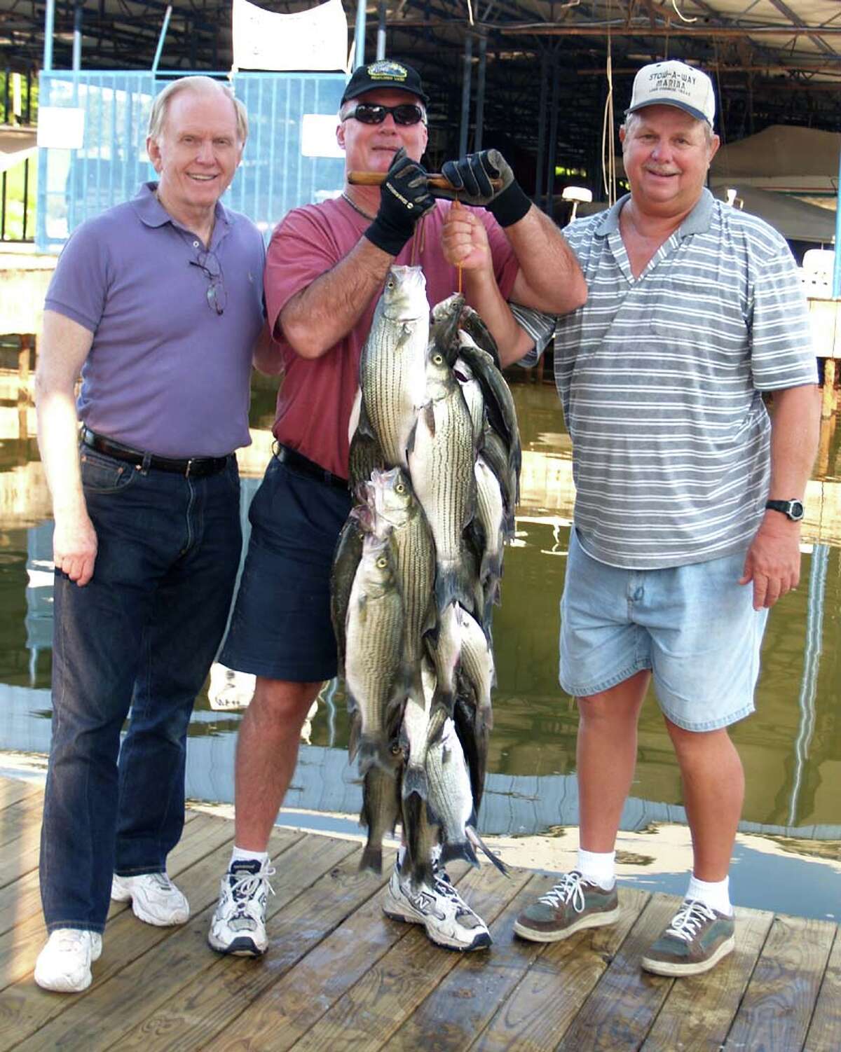 Fishing guides like Butch Terpe (right) can take you to the fish and show you how to catch them.