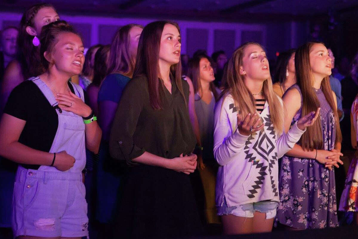 Every evening is filled with song as the Stonegate praise band sang worship songs during Stonegate Fellowship's summer camp in Glorieta, NM. Photo by Russ Rogers