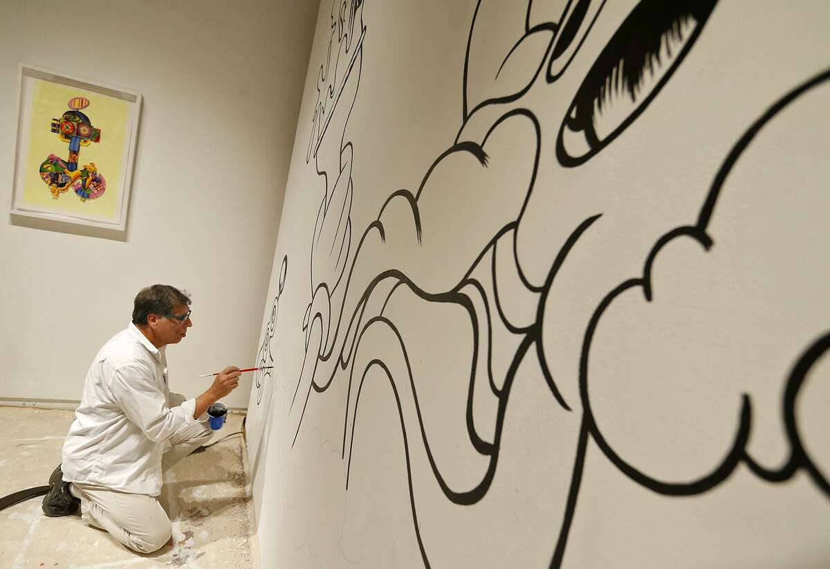 John A. Hernandez work on his mural “Octopus's Garden,” part of the “Daydreams and Other Monsters” at the UTSA Main Gallery.
