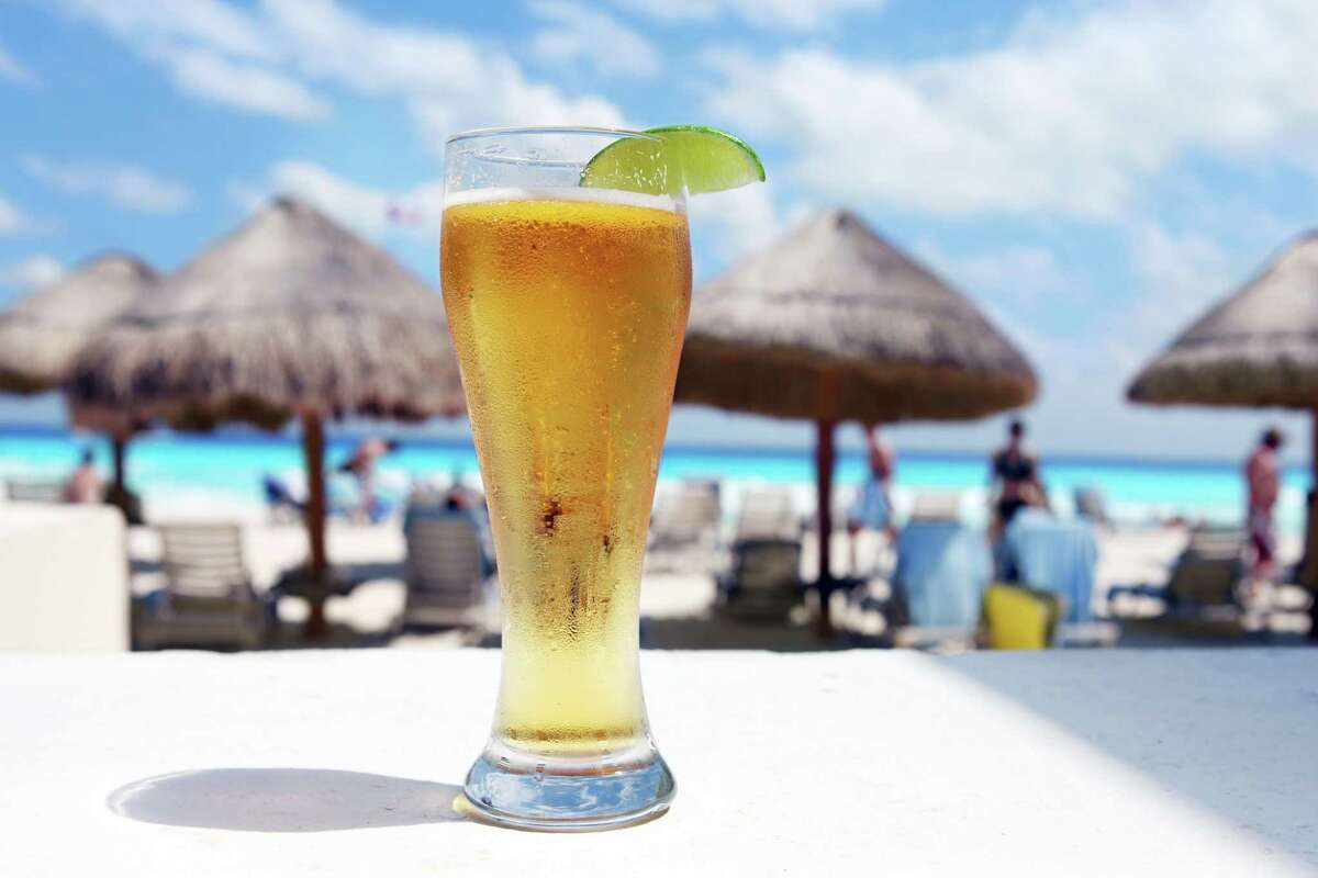 Ice cold beer on a beautiful tropical beach in Cancun, Mexico.