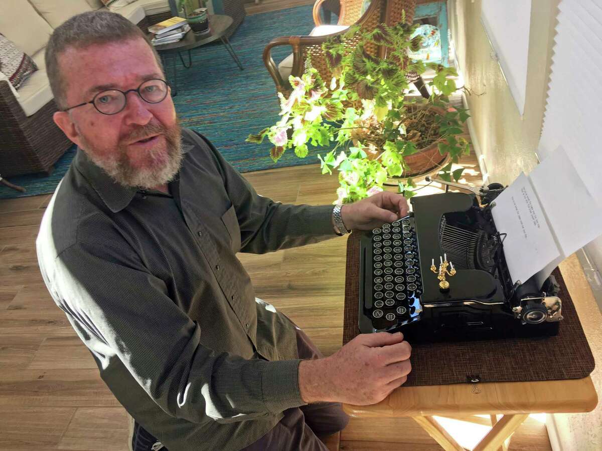 In this Feb. 21, 2017 photo, Joe Van Cleave, who runs a popular YouTube channel on restoring typewriters, speaks about one of his vintage typewriters at his home in Albuquerque, N.M. The vintage typewriter is making a comeback with a new generation of fans gravitating to machines that once gathered dust. (AP Photo/Russell Contreras)