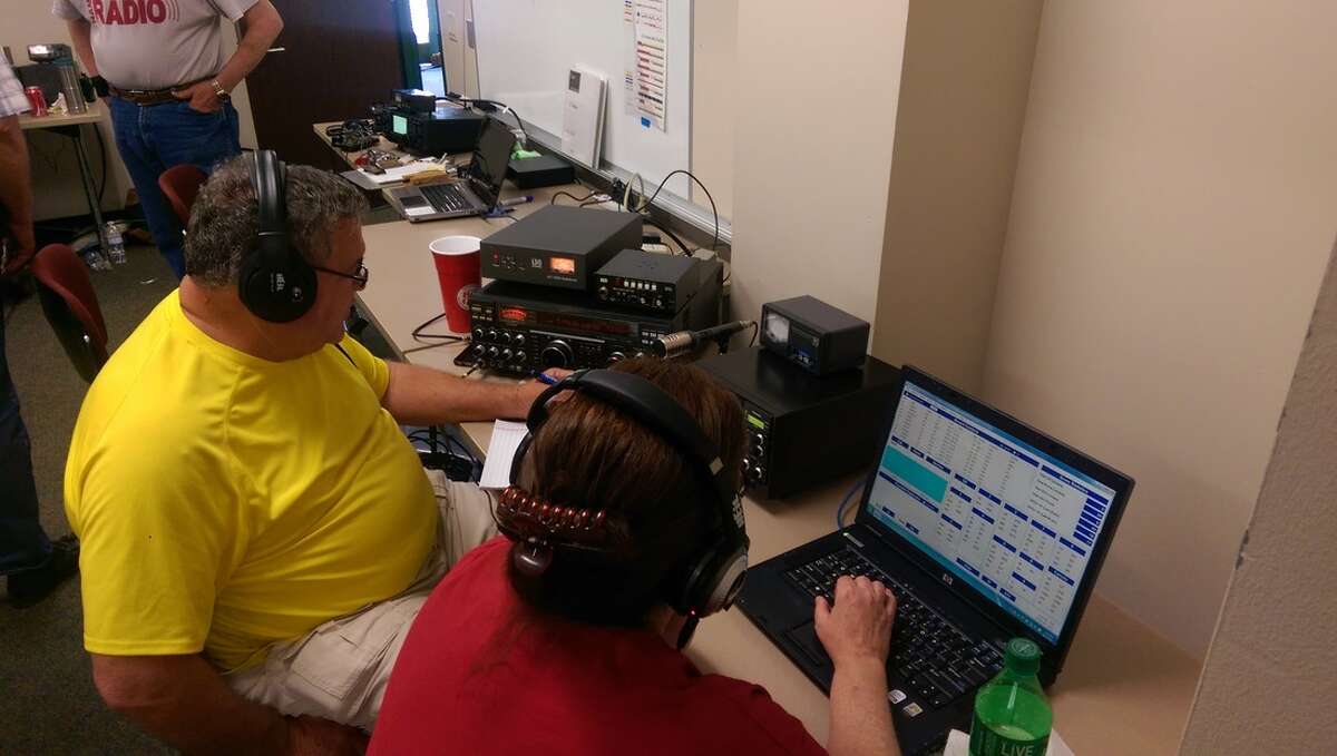 Ham radio operators log connections during a past Field Day event.