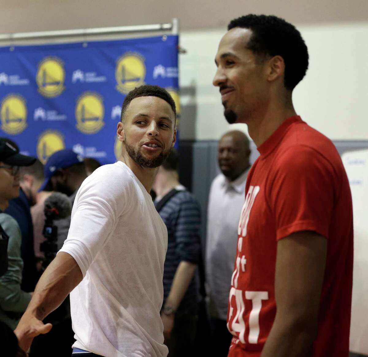Golden State Warriors' Stephen Curry, left, and Shaun Livingston speak with reporters during a news conference Wednesday, June 14, 2017, in Oakland, Calif. The Warriors won the NBA championship over the Cleveland Cavaliers earlier in the week.. (AP Photo/Ben Margot)