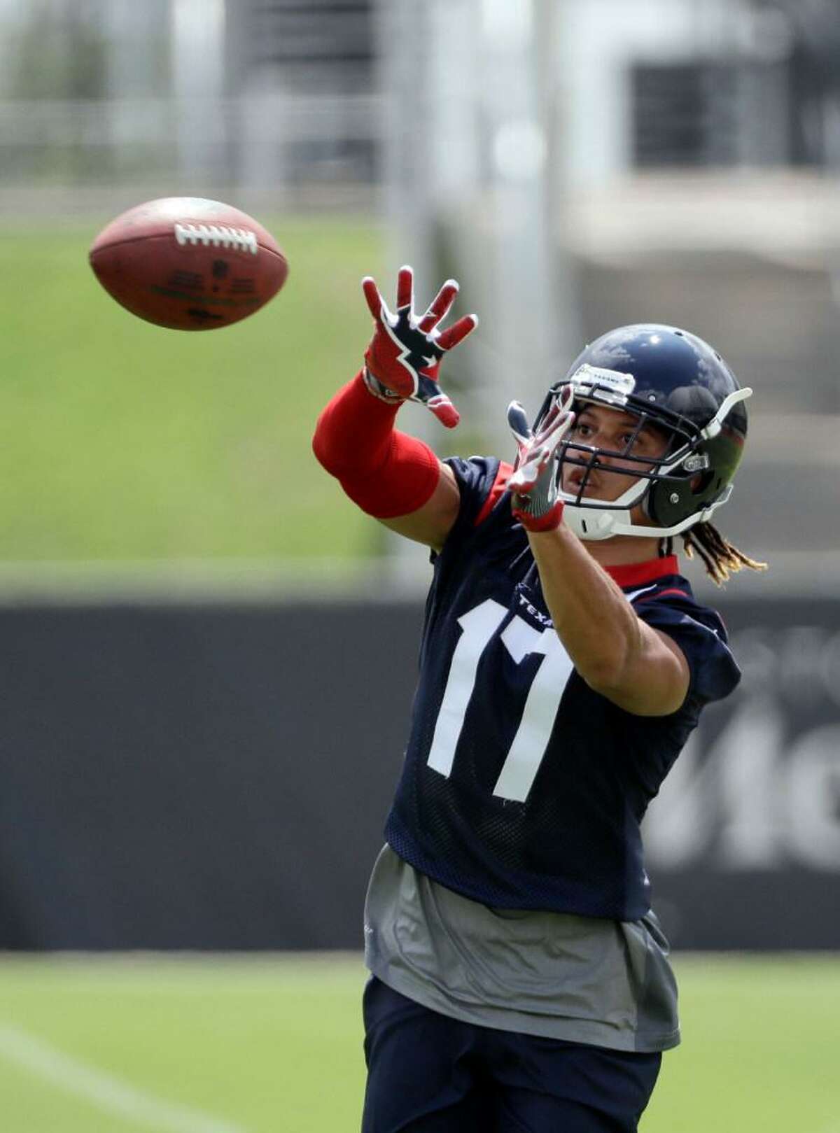 Houston Texans wide receiver Dres Anderson catches a pass during an NFL organized team activities football practice Tuesday, June 6, 2017, in Houston.