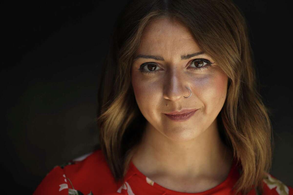Hannah Zwick poses for a portrait in San Diego. Zwick, 25, put herself through college by working as a fundraiser for her university under the federal work-study program. The Trump administration’s 2018 budget seeks to cut funding for work-study nearly in half from $990 million to $500 million.