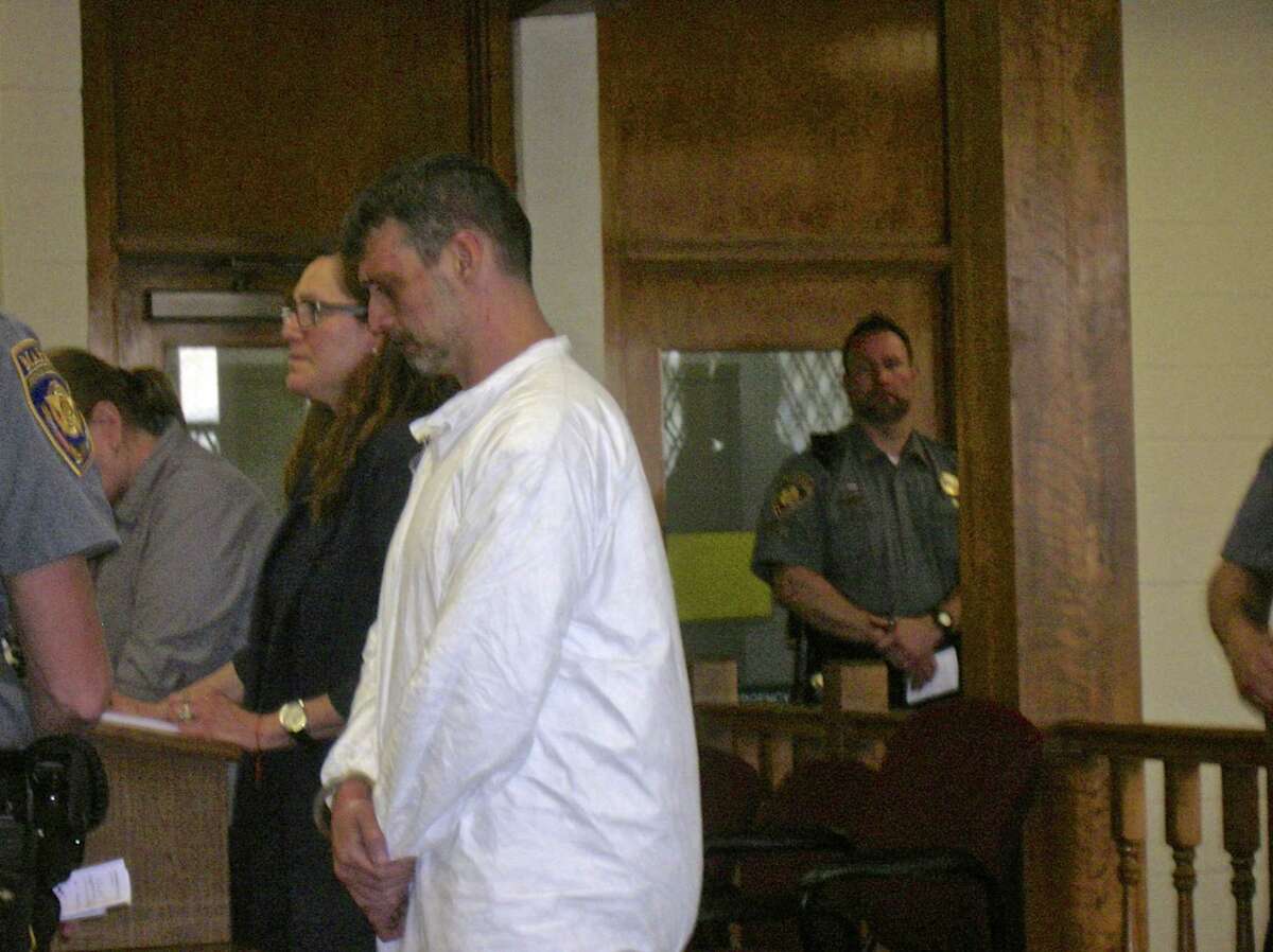 Bethel resident Mark Benoit stands beside his attorney, Susan Filan, during his arraignment in Bantam Superior Court Thursday on home invasion, assault and stalking charges.