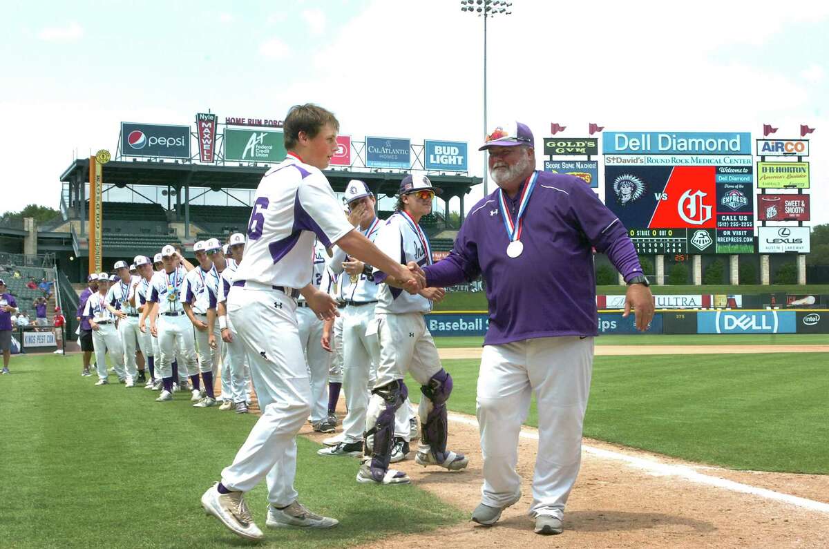 Port Neches-Groves pitcher Brandon Morse is congratulated by coach Scott Carter after Morse was announced as the Class 5A state baseball final MVP after the Indians defeated Grapevine, 4-2, for the championship on Saturday, June 10 at Dell Diamond in Round Rock. (Mike Tobias/The Enterprise)