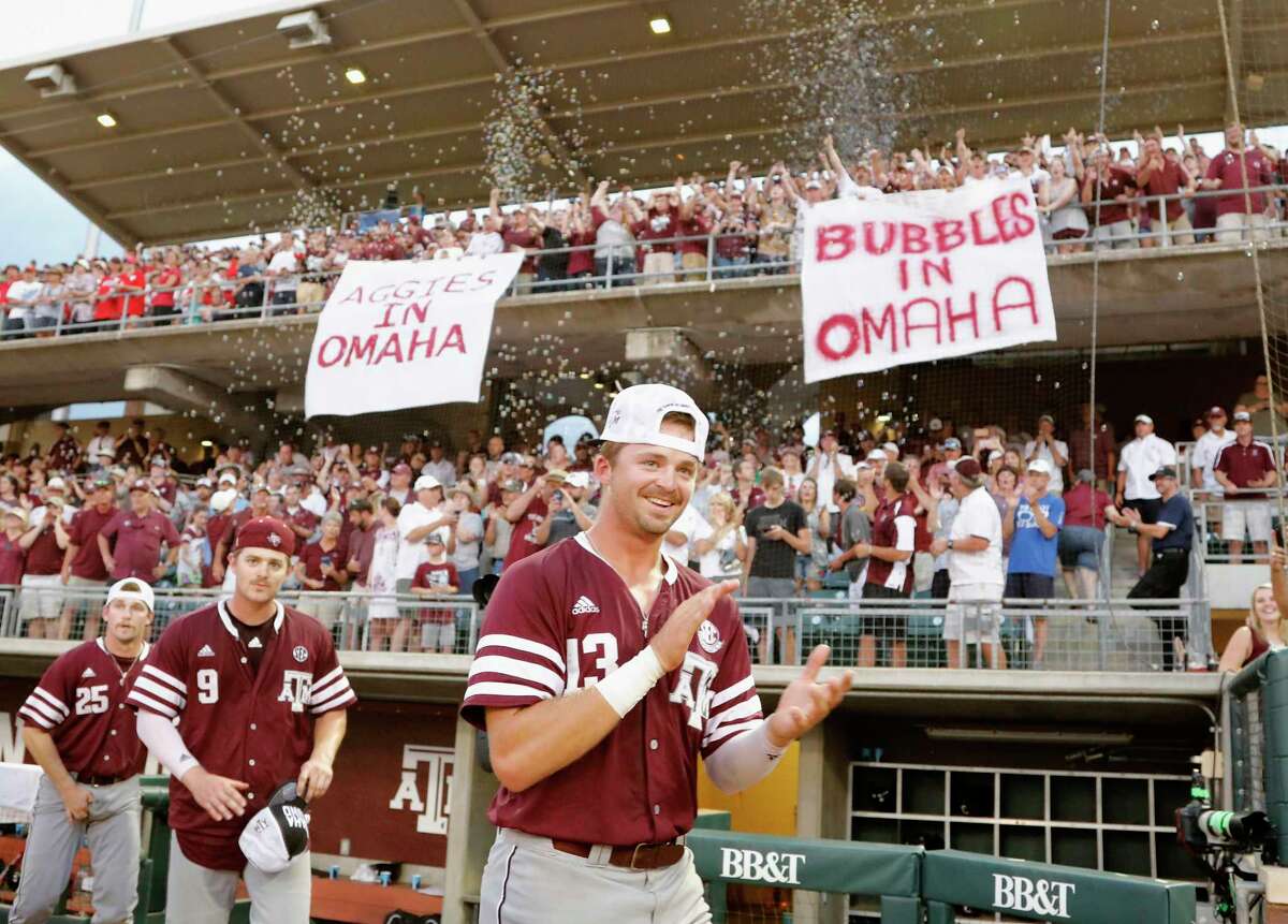 Texas A&M outfielder Blake Kopetsky (13), outfielder Walker Pennington (9), and infielder Austin Woman (25) celebrate after the 2017 NCAA Super Regional baseball game between the Davidson Wildcats and the Texas A&M Aggies at Blue Bell Park on Saturday, June 10, 2017, in College Station, TX.