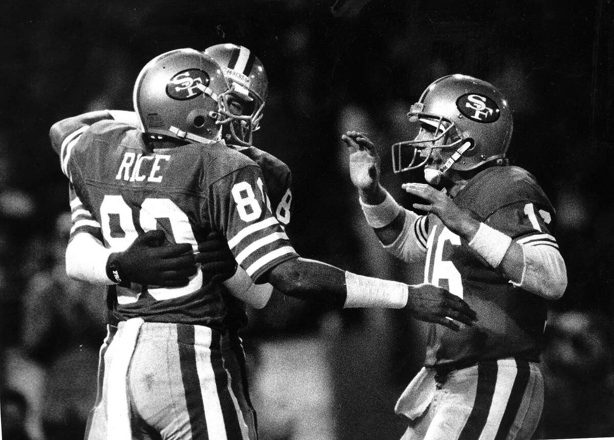 49ers Joe Montana congratulates Jerry Rice after a 2nd quarter touchdown pass, November 29, 1987 Photo ran 11/30/1987, p. D1