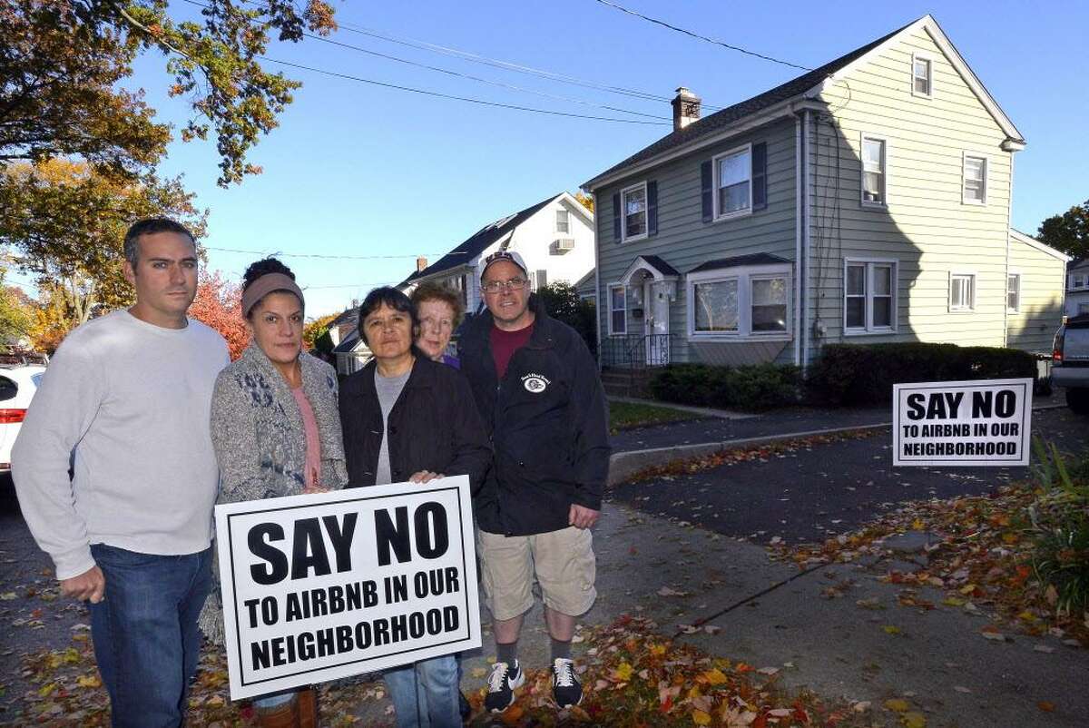 In 2016, Stephen Rich, Emily Ray, Gaby Pareja, Kathleen Connole and Anthony Rinaldi (from left to right) protested outside a house in Stamford that was listed on Airbnb. File photo