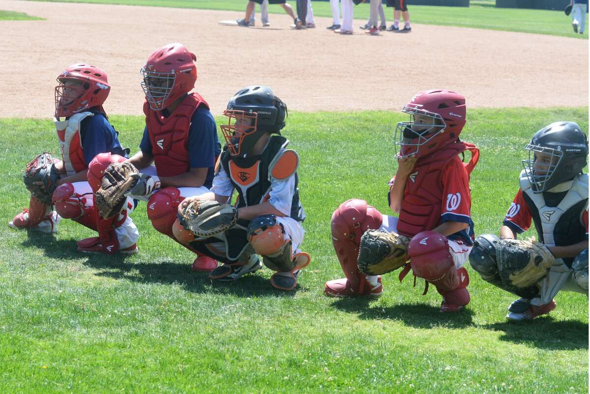 Catchers get into their squats and prepare for action during the Bulldog Baseball Camp last year. This year's camp will be next week from Monday through Wednesday.