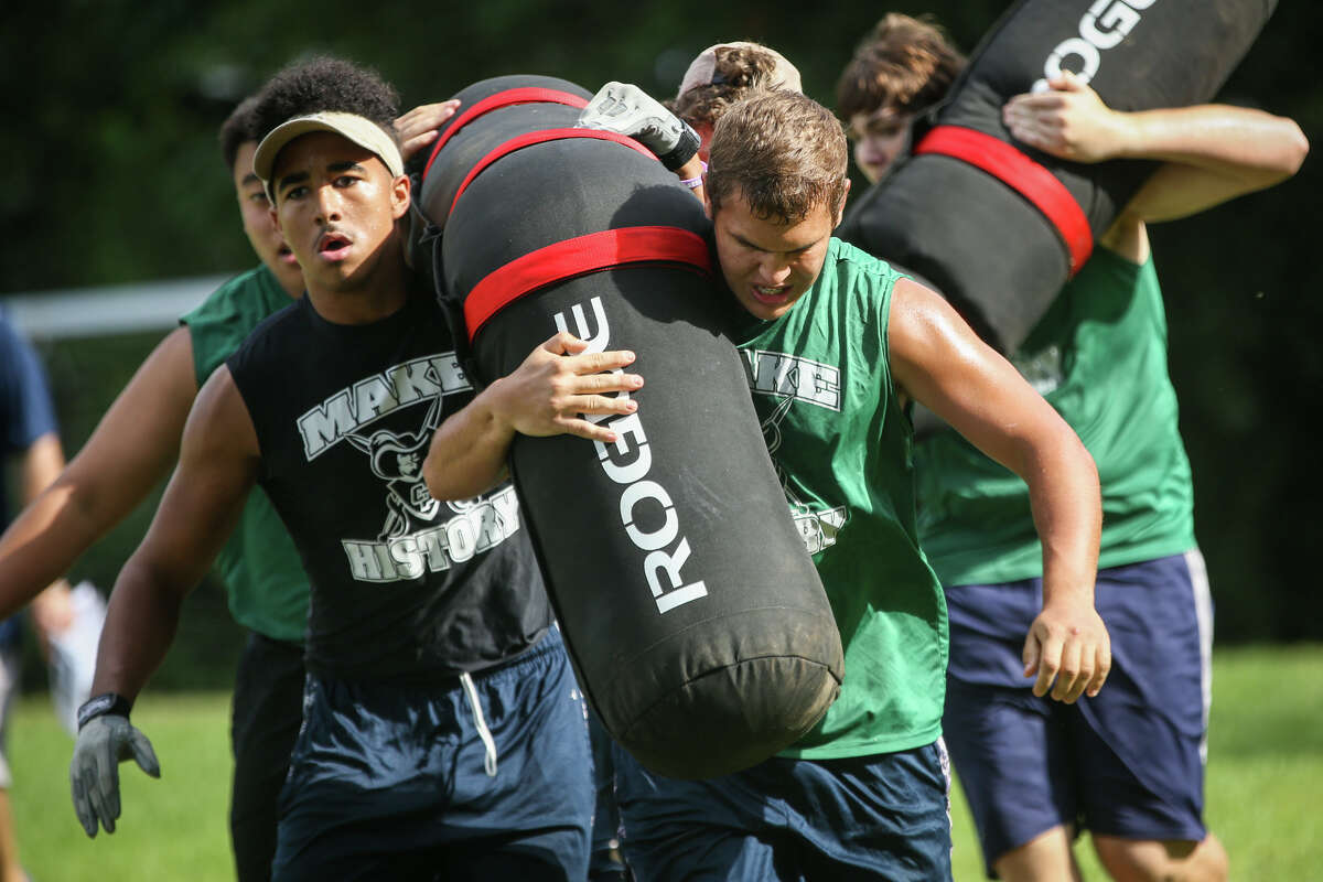College Park linemen participate in the Worm Carry event during the Oak Ridge War Zone Lineman Challenge on Saturday, June 18, 2016, at Oak Ridge High School. (Michael Minasi / Chronicle)