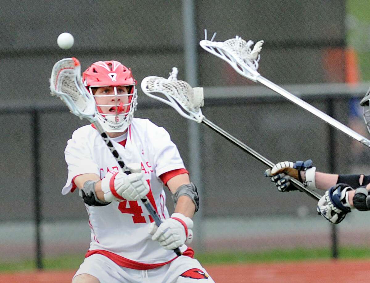 Jack O’Connor of Greenwich passes against Brien McMahon High School on May 9. O’Connor, one of the Cardinals’ senior captains earned Second Team All-State honors and was an All-FCIAC First-Team selection. O’Connor recorded 29 goals on the season for Greenwich.