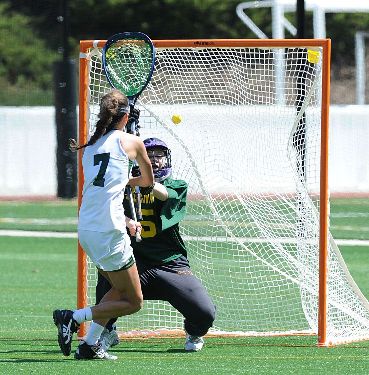 Sacred Heart’s Grace Paletta (7) scores getting a shot past Greenwich Academy goalie Maggie Reville during the second half on April 30, 2016. Paletta, Sacred Heart’s senior captain, was named to the U.S. Lacrosse Connecticut All-America Lacrosse Team. The All-America Team includes 21 public and private school players from the state.