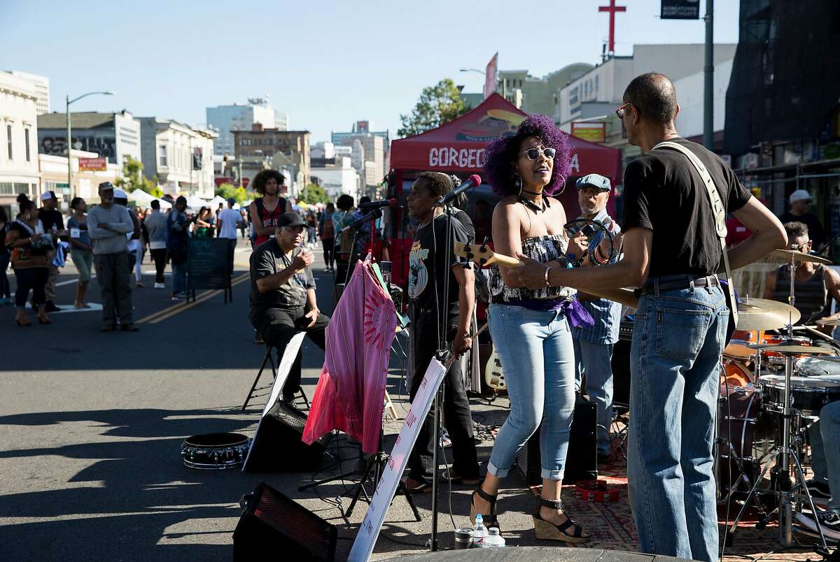 The band Phat Luv performs for attendees of the Oakland First Fridays street festival in Oakland, Calif., on Friday, June 2, 2017. The art, music, food and community festival takes place every first Friday of the month, weather permitting. Telegraph Avenue is closed to traffic between West Grand Avenue and 27th Street for the festivities.