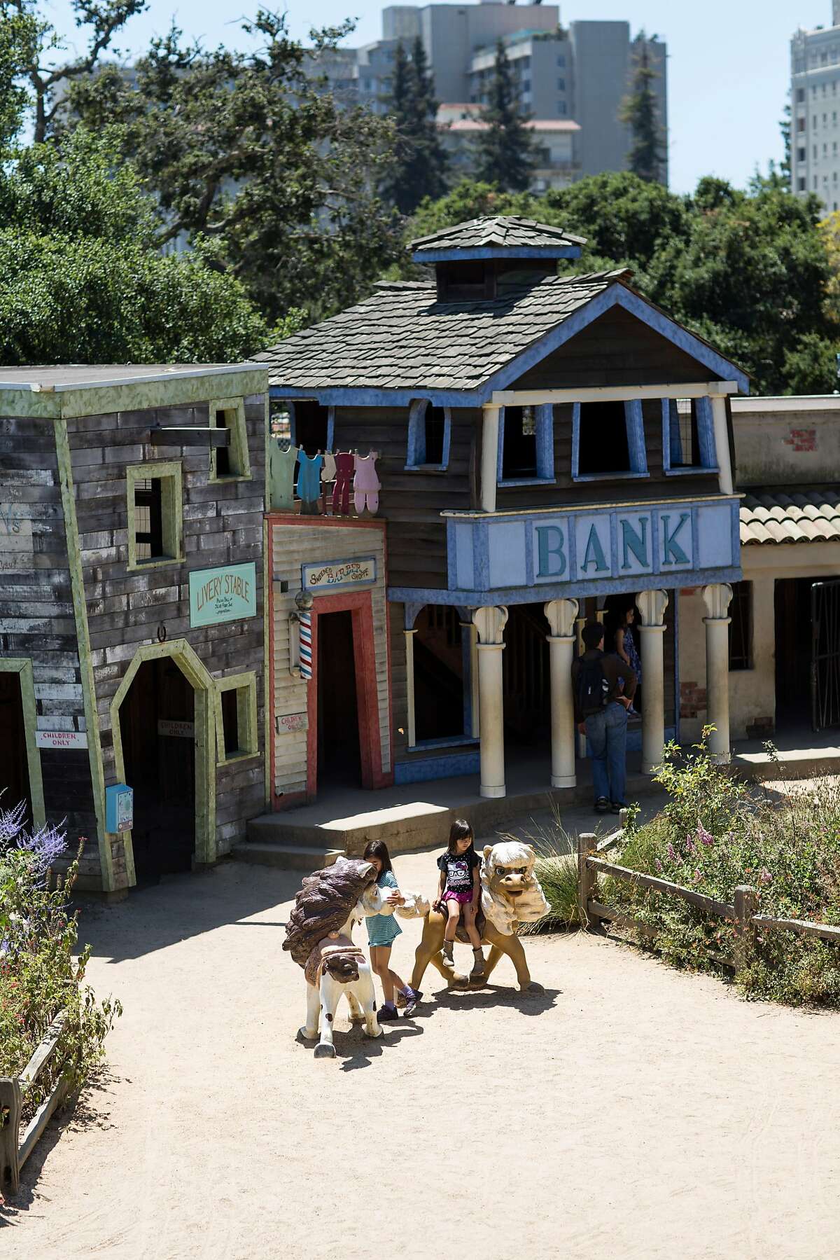 Children and families play in the Old West Junction attraction at Children's Fairyland in Oakland, Calif., on Sunday, June 4, 2017. The classic children's amusement park is located on the shores of Lake Merritt.