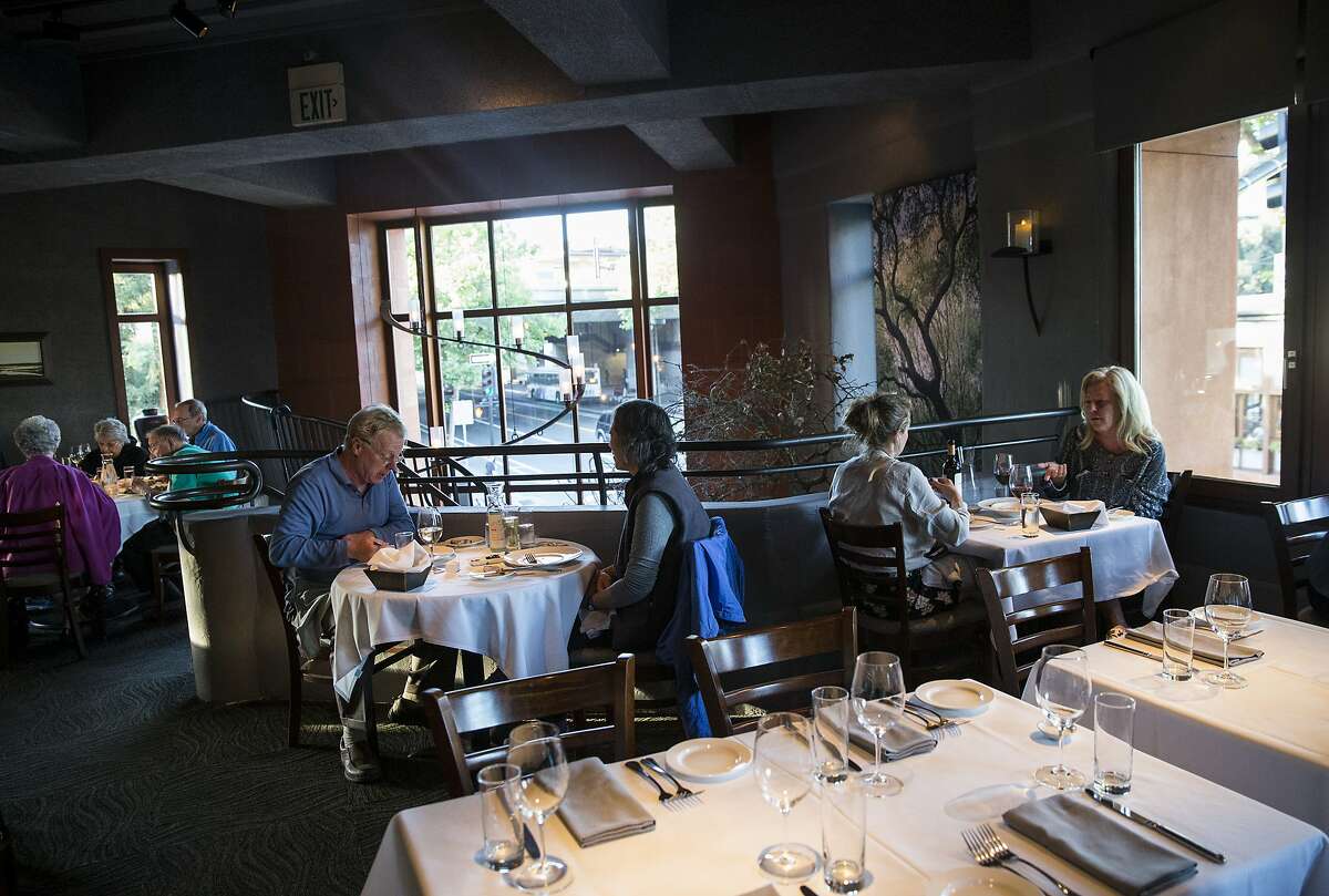 Visitors to Oliveto have dinner in the main dining room at the restaurant in Oakland, Calif., on Sunday, June 4, 2017. The Rockridge neighborhood restaurant, located in the landmark Rockridge Market Hall, has been in business for over 30 years.