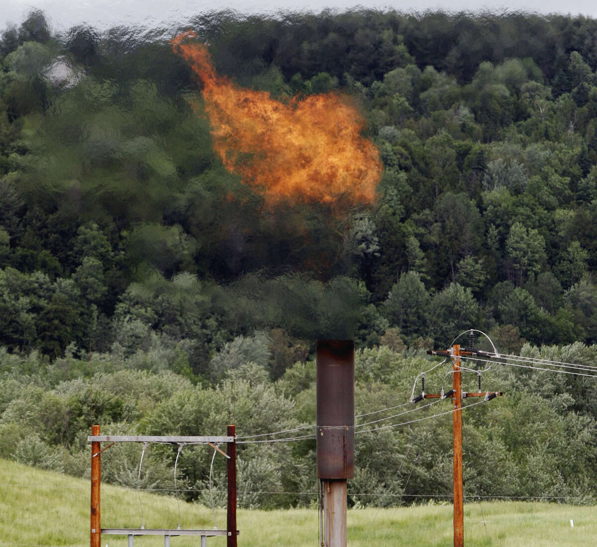 Methane burns at a landfill in Coventry, Vt. The Trump administration is delaying two Obama-era regulations aimed at restricting harmful methane emissions from oil and gas production. ﻿