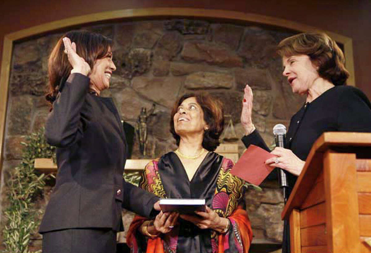 Harris wins a second term in an uncontested race  Harris was sworn in to a second term in office after garnering more than 98 percent of the vote in the first uncontested San Francisco district attorney race since 1991. In this file photo from Jan. 8, 2008, District Attorney Harris (left) is sworn in by US Senator Dianne Feinstein (right) at the Delancey Street Town Hall in SF. In the center is Harris' mother Shymala Harris.