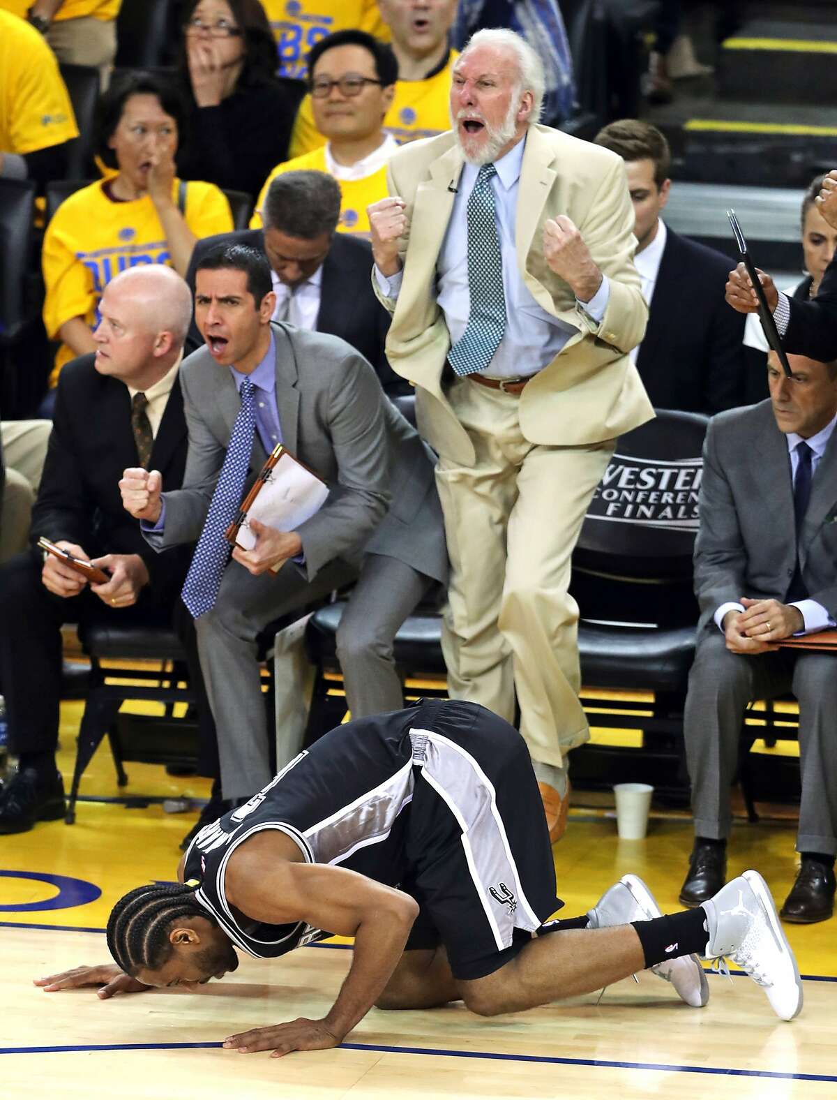 San Antonio Spurs' coach Gregg Popovich reacts to Kawhi Leonard re-injuring his ankle in 3rd quarter of Golden State Warriors' 113-111 win during Game 1 of NBA Western Conference Finals at Oracle Arena in Oakland, Calif., on Sunday, May 14, 2017.