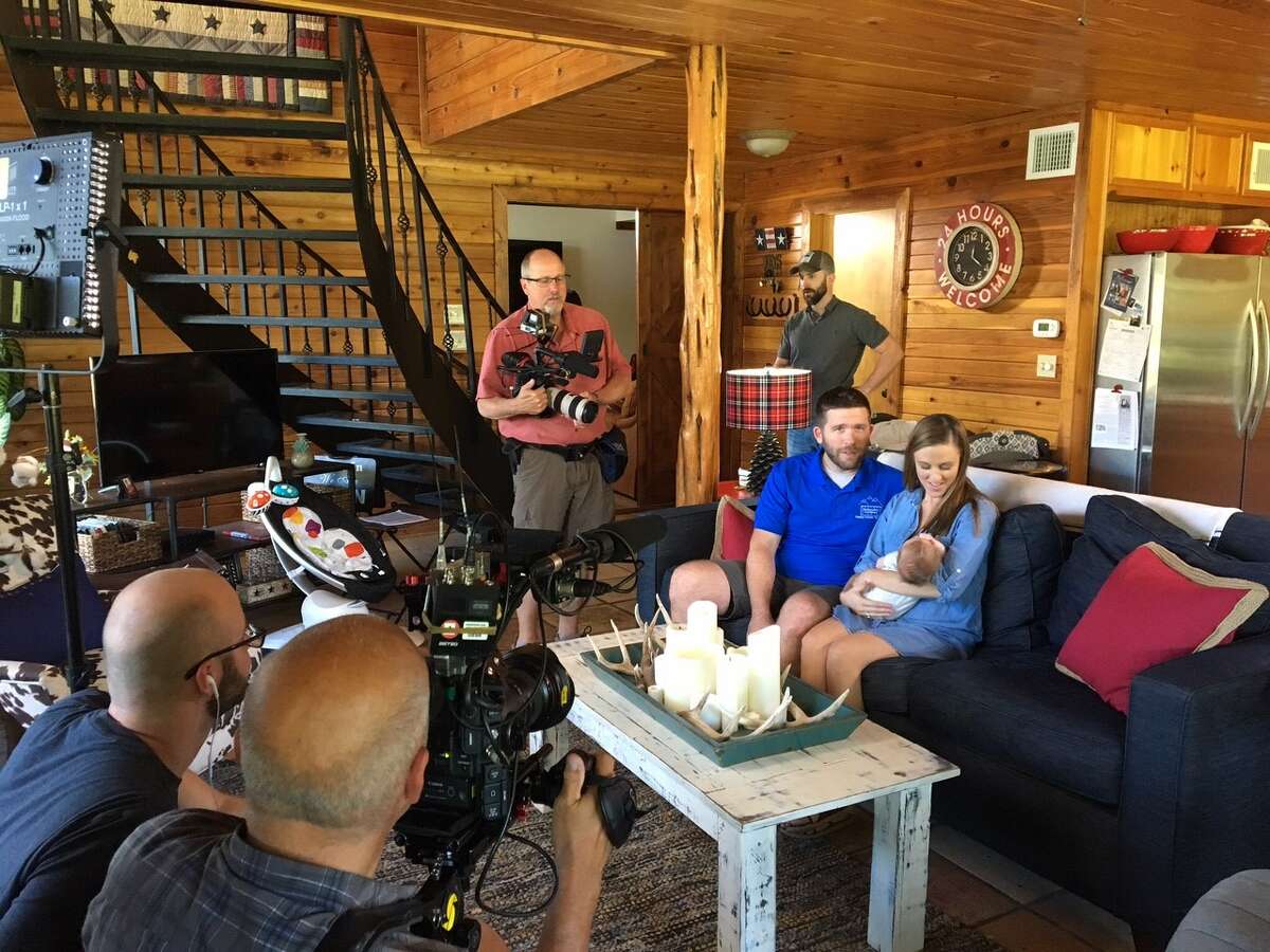 Jon Meier and Kristen Flowers are filmed with their newborn for footage in a new DIY/HGTV reality show about Houston business, Backcountry Containers.