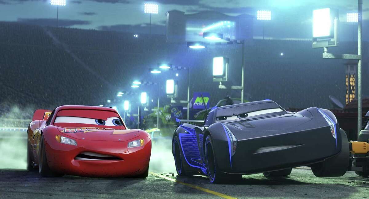 Lightning McQueen (left), is voiced by Owen Wilson, and Armie Hammer voices his younger rival, Jackson Storm, in “Cars 3.”