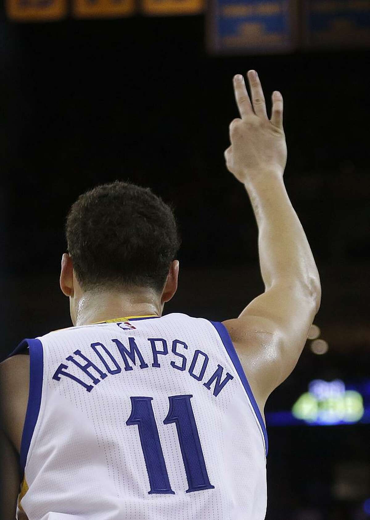 Klay Thompson celebrates a three- pointer in a game in December; he and Stephen Curry combined for 592.