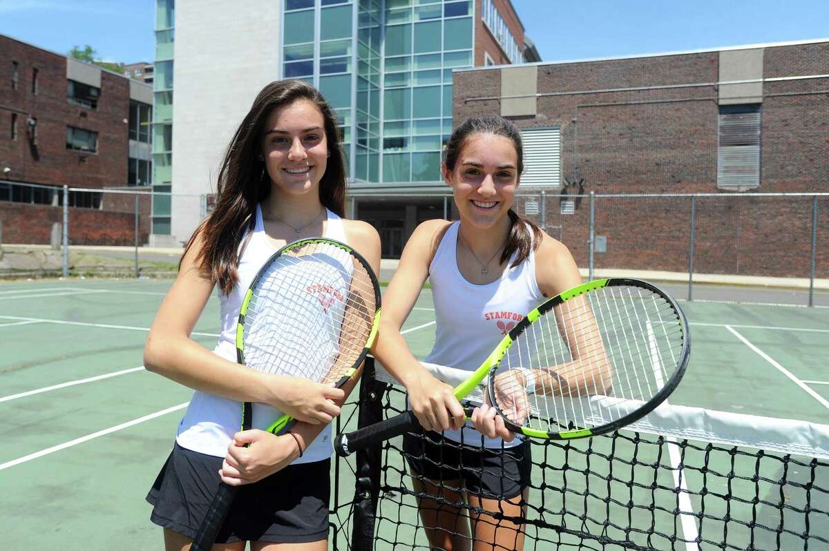 Stamford High freshman Devon, left, and Taylor Yaghmaie pose for a photo on the tennis courts behind Stamford High School in Stamford, Conn. on Wednesday, June 14, 2017. The twins won the CIAC girls doubles championship last week at Yale to cap off an impressive season.
