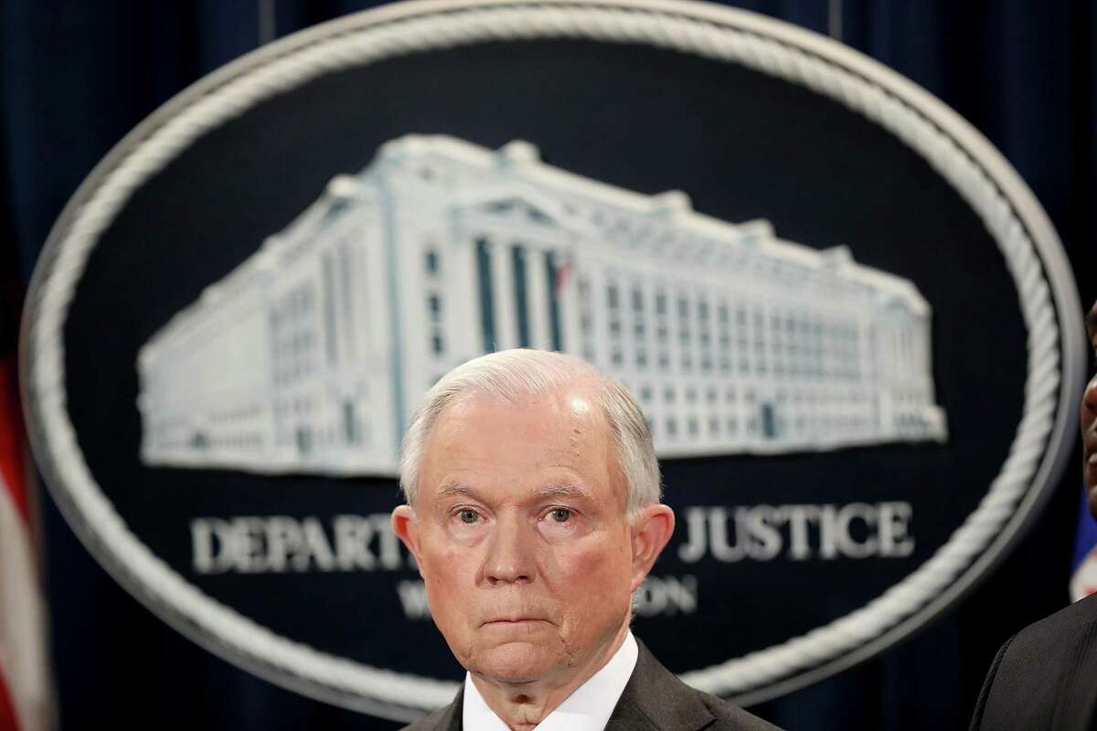 U.S. Attorney General Jeff Sessions speaks during an event at the Justice Department in May in Washington, D.C. Defense and spy-agency contractor Booz Allen Hamilton says the Justice Department is investigating a subsidiary’s accounting and the way it charges the government.