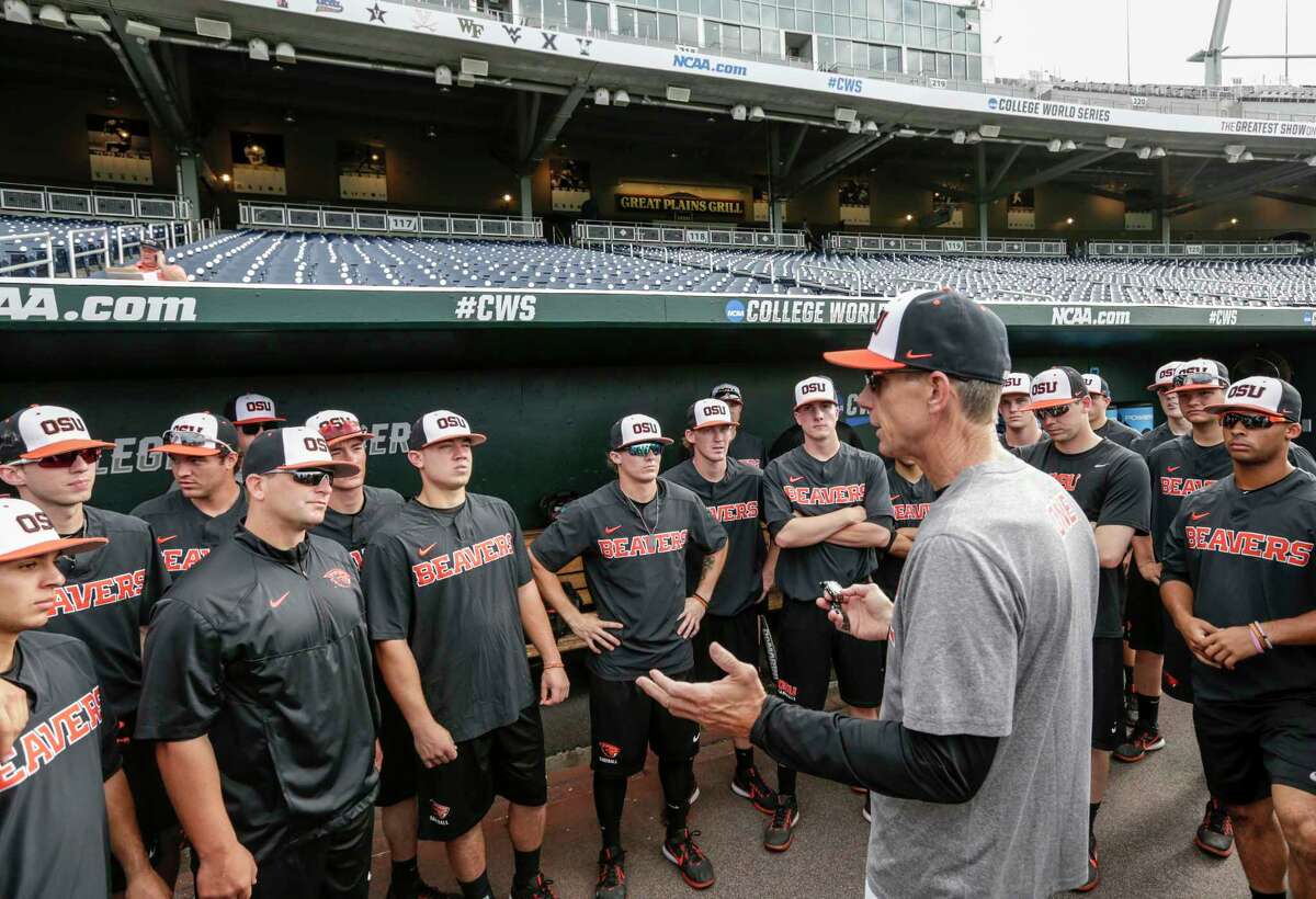 Oregon State coach Pat Casey addresses his players in the dugout before team practice in Omaha, Neb., Friday, June 16, 2017. Oregon State is on the cusp of joining the company of the greatest college baseball teams of all time. At 54-4, the Beavers enter the College World Series with the fewest losses of any team since 1982. (AP Photo/Nati Harnik)