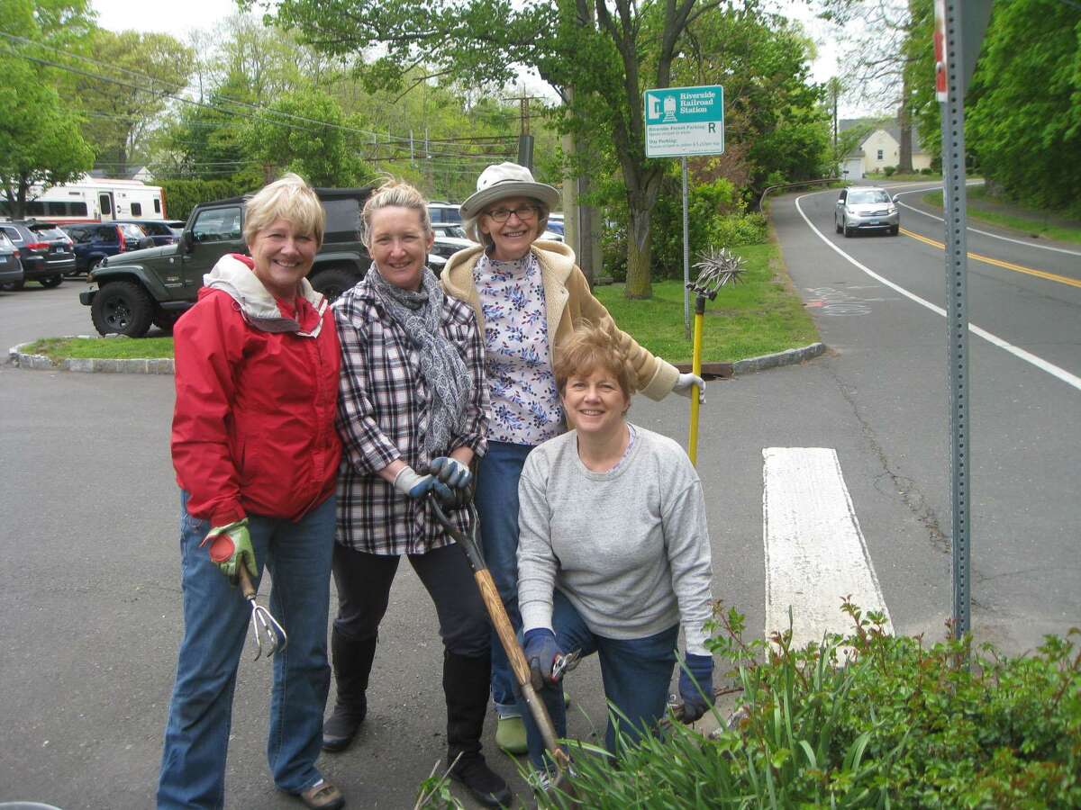 From left, Jane Harris, club president Gaby Crouchley, Susan Foster with Linda Porter of the Riverside Garden Club are taking time out from their spring planting and sprucing up at the south garden of the Riverside Railroad Station